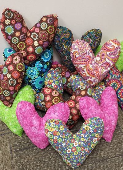 We made 100 beautiful heart shaped pillows for the Bundles of Hope Bags and donated them along with $600 to the Pink Ribbon Society - Feb 2017